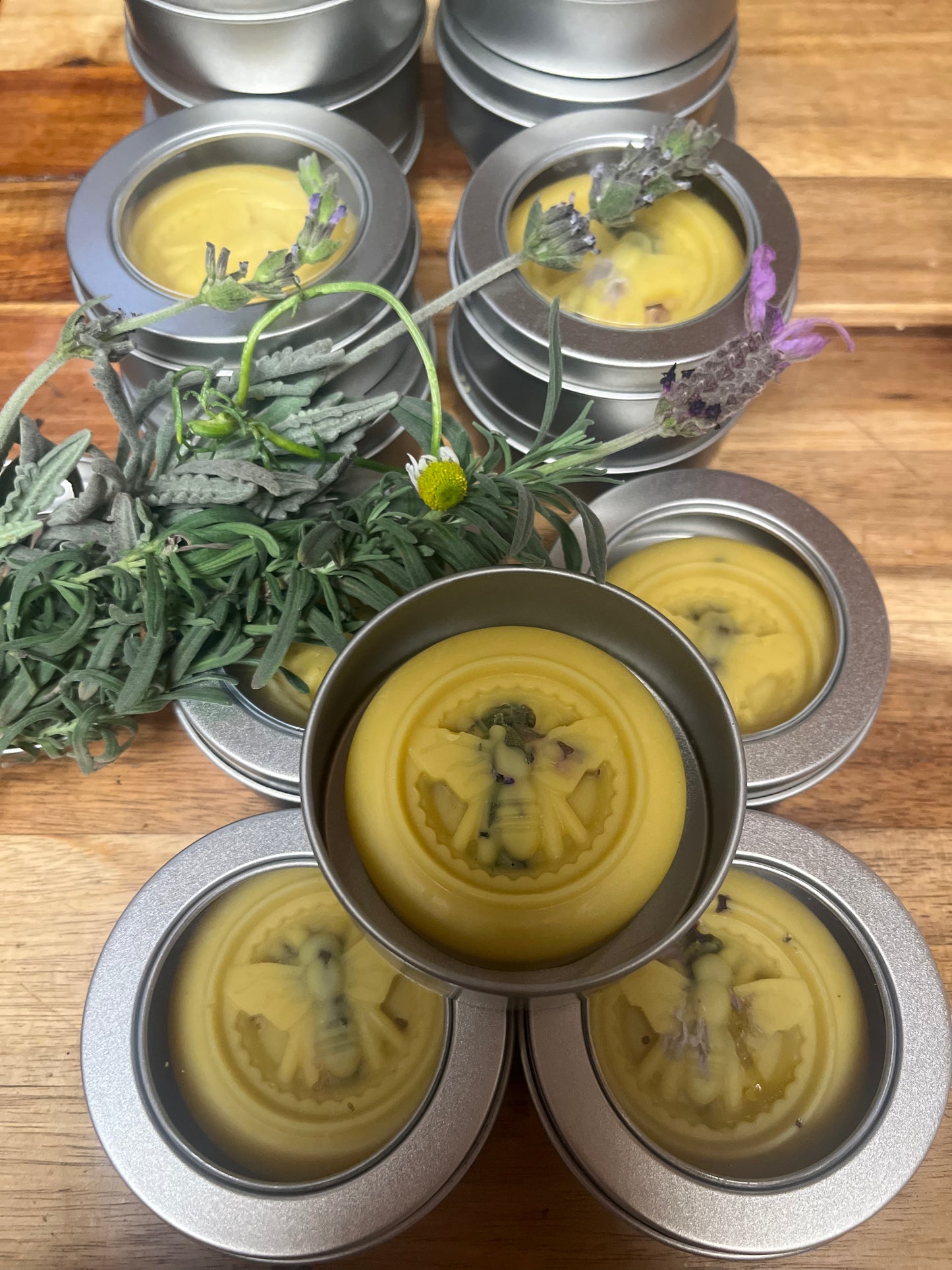 Candle tins with yellow lotion bar
